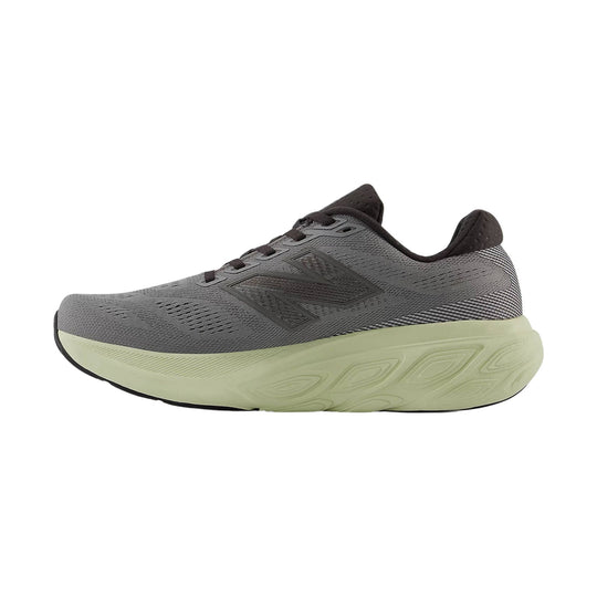 Gray running shoe with black accents and a thick light green foam sole, side view