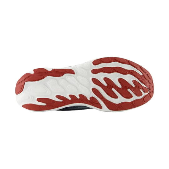 White running shoe outsole with red rubber traction pods