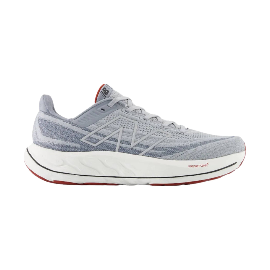 Gray mesh running shoe with white cushioned sole, red outsole accents, and visible FRESHFOAM+ marking