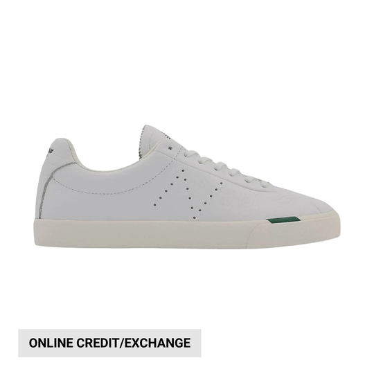 White low-top sneaker with a thick off-white sole and green accent on the outsole