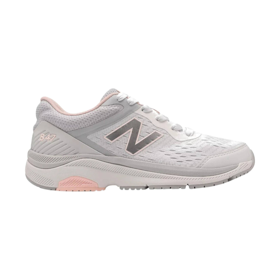 Light gray walking shoe with white laces, pink accents, and a large side logo