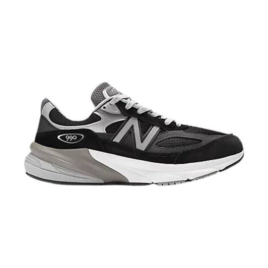Black, gray, and white athletic sneaker with mesh panels, laces, and a visible 990 badge