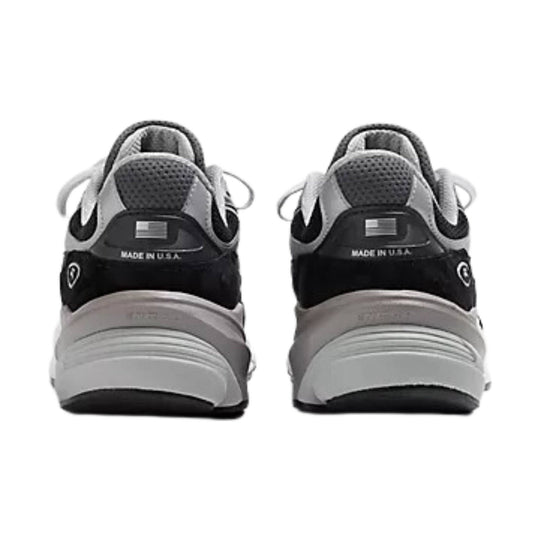 Black and gray running shoes shown from the heel, with Made in U.S.A. text