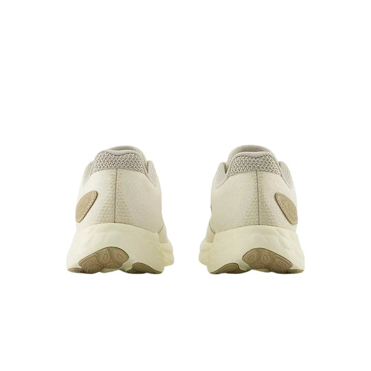 Beige athletic running shoes shown from the back