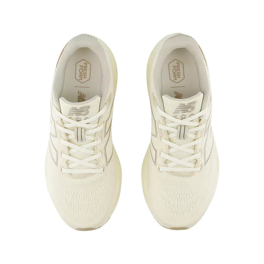 Cream low-top running shoes with mesh uppers, white laces, and visible Fresh Foam insoles
