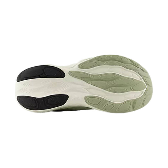 Shoe outsole with black rubber traction pods and light green tread sections
