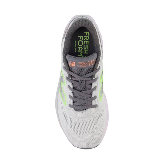 White and gray running shoe with lime accents, gray laces, and Fresh Foam 880 branding
