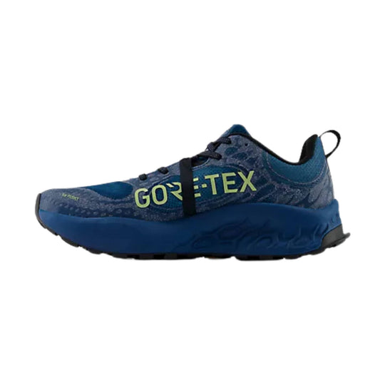 Blue trail running shoe with GORE-TEX text and chunky sole, side view