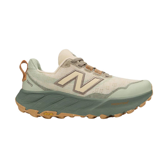 Beige and sage trail running shoe with a chunky sole, orange pull loop, and side logo