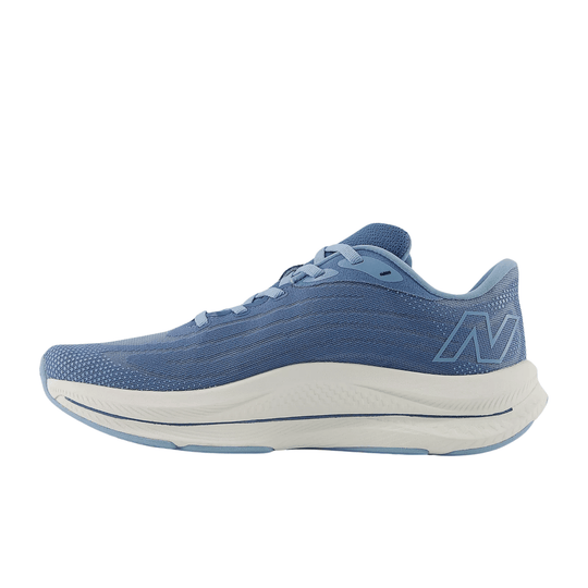Blue athletic walking shoe with a white cushioned sole and side N logo