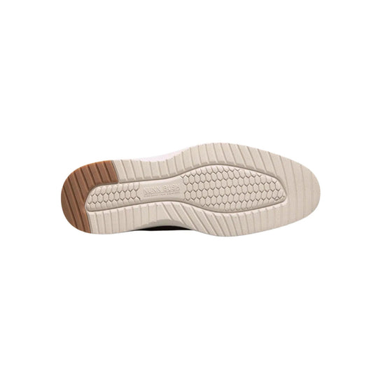 Beige sneaker outsole with brown heel tread and hexagon traction pattern