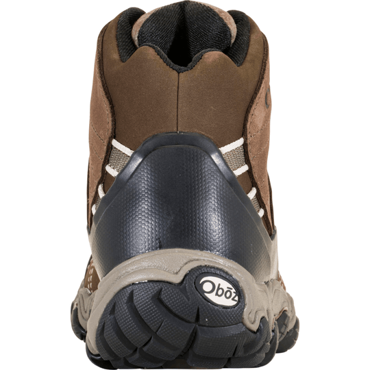 Rear view of a brown mid-height hiking boot with black rubber heel protection and Obōz logo