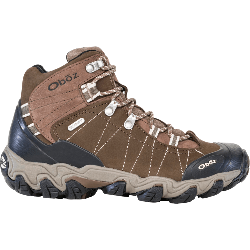 Brown and tan mid-height hiking boot with black rubber toe cap and lugged sole