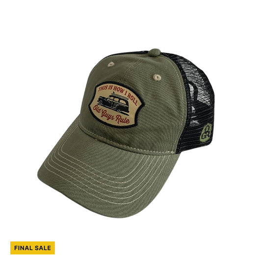 Olive and black trucker hat with a vintage car patch and curved brim
