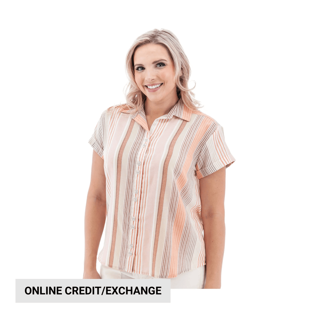Woman wearing a short-sleeve striped button-up shirt in peach, white, and beige