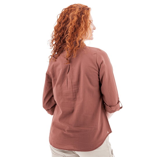 Rusty rose long-sleeve blouse shown from the back, with rolled sleeves and a curved hem