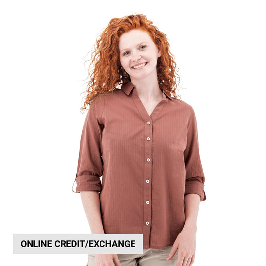 Rust-colored long-sleeve button-up shirt on a smiling model, with "ONLINE CREDIT/EXCHANGE" text at the bottom