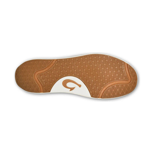 Tan rubber shoe outsole with circular tread pattern and white midfoot insert