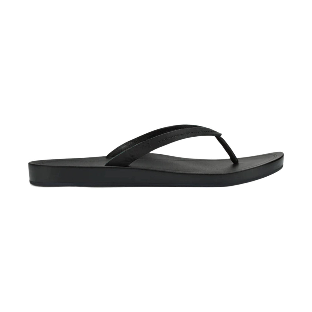 Black thong sandal with a thick platform sole, side profile