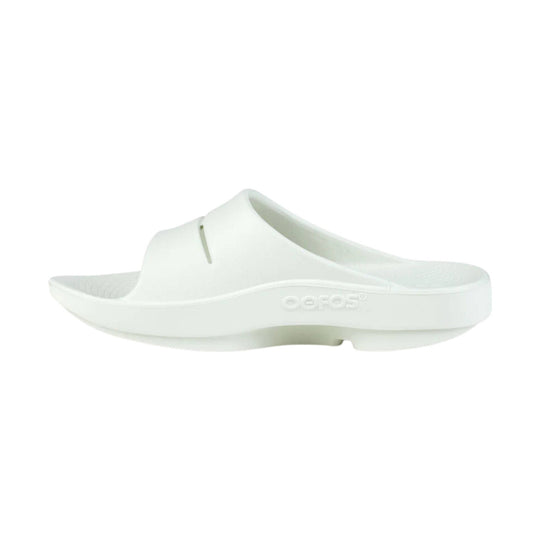 White slide sandal with molded footbed and embossed side logo