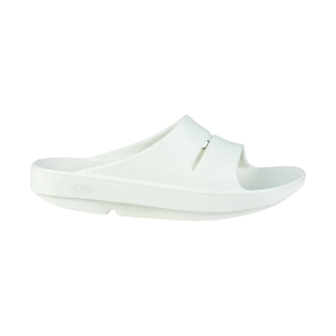White slip-on slide sandal with a cushioned footbed and wide strap