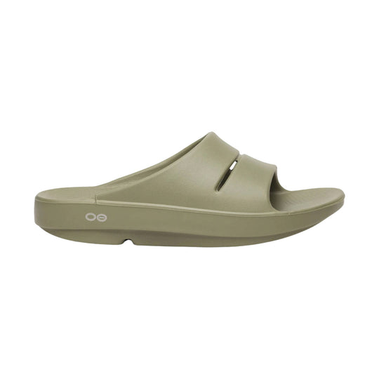 Beige foam slide sandal with a wide molded strap, open toe, and side logo