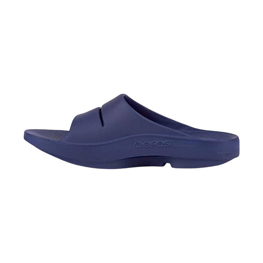 Navy slide sandal with a contoured footbed and raised side branding