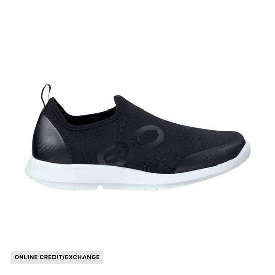 Black slip-on sneaker with white sole and visible ONLINE CREDIT/EXCHANGE label