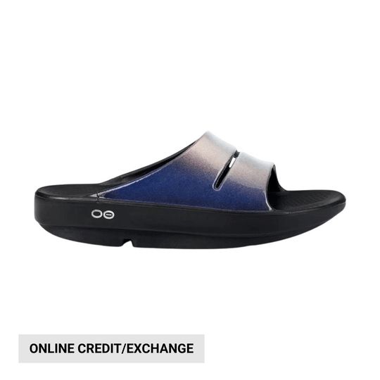 Blue-to-gray slide sandal with a black cushioned sole and side logo