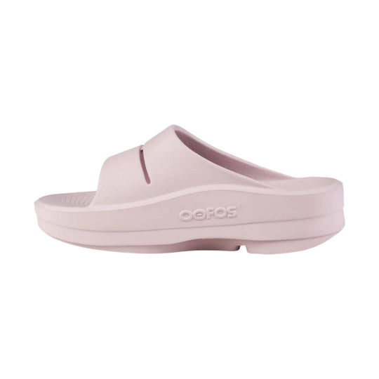 Light pink platform slide sandal with a molded foam upper and embossed side logo