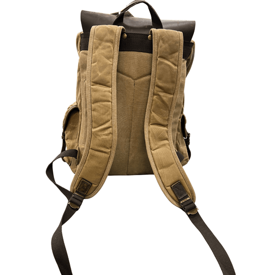 Tan canvas backpack with dark brown leather accents, top handle, and padded shoulder straps, shown from the back