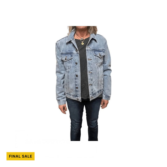 Light-wash denim jacket with chest flap pockets and metal buttons, shown over a black top and dark jeans