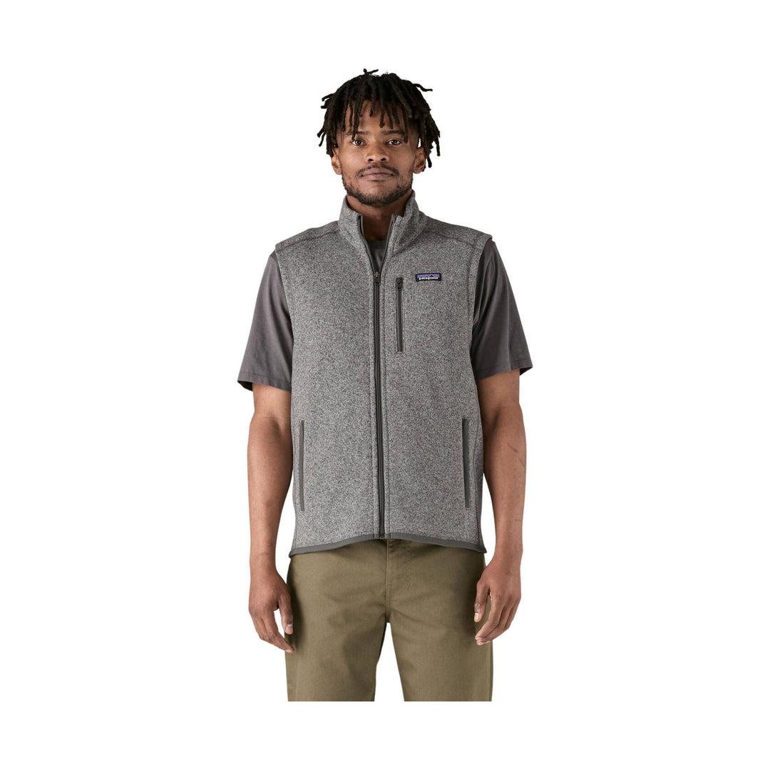 Gray heathered fleece vest with full-zip front and chest logo, worn over a dark short-sleeve shirt
