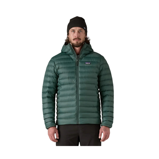 Dark green hooded puffer jacket with front zipper and Patagonia logo patch
