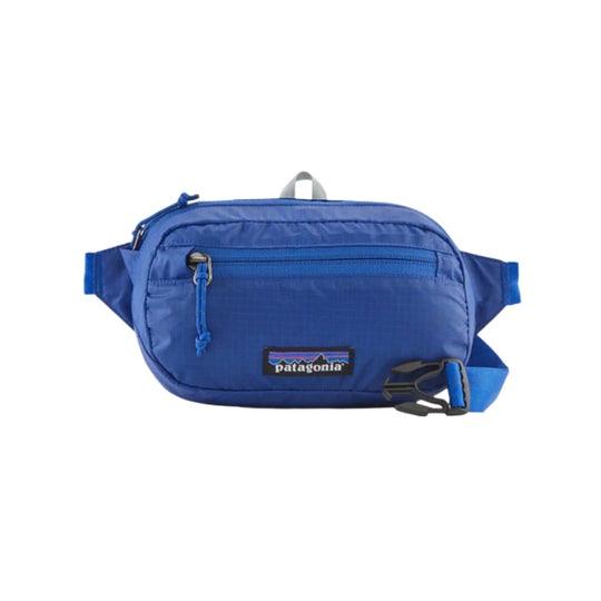 Blue waist pack with front zip pocket and Patagonia logo patch