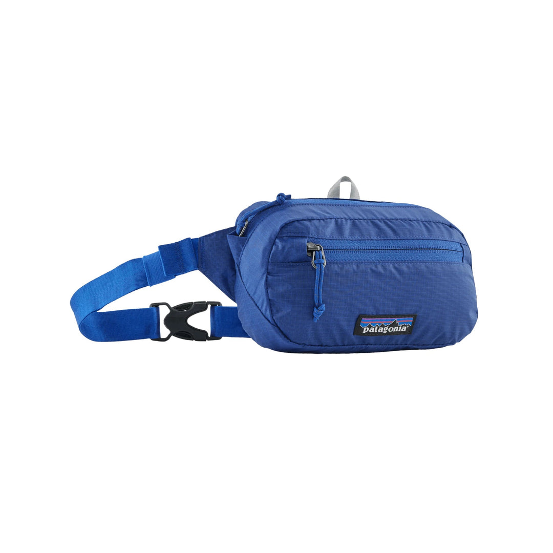 Blue nylon waist pack with front zipper pocket and Patagonia patch logo