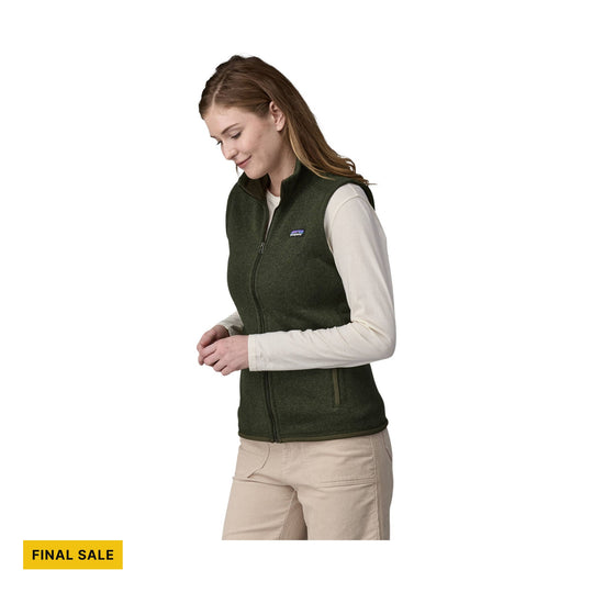 Dark green fleece vest over a cream long-sleeve top, shown in side view with a visible FINAL SALE tag