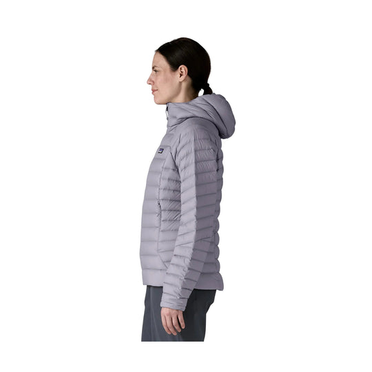 Light gray quilted hooded puffer jacket shown in side profile