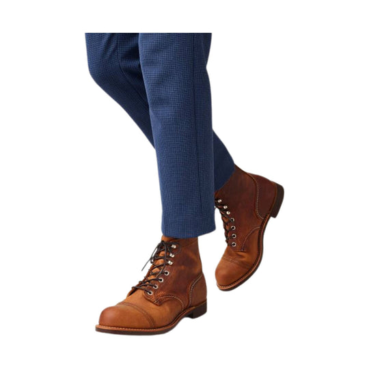 Brown leather lace-up ankle boots with cap toes and stacked heels