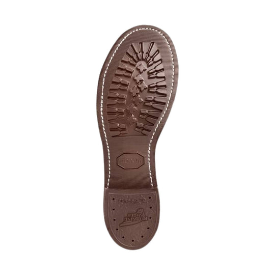 Brown boot sole with deep tread and embossed Red Wing Shoes branding