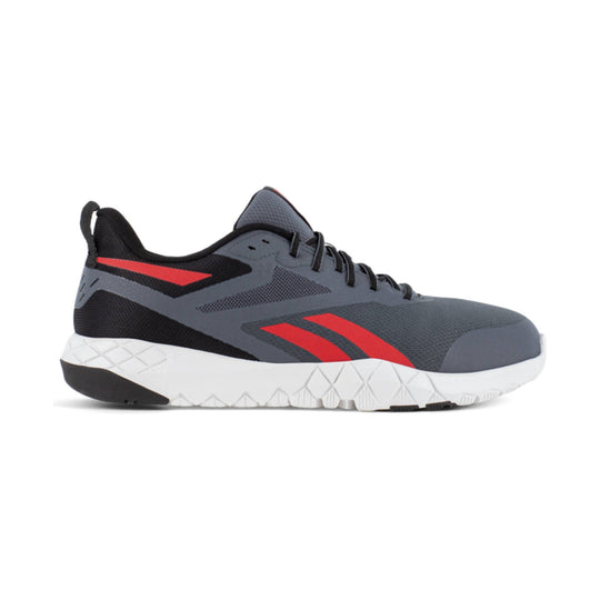Gray and black athletic work shoe with red side accents and white textured sole, side view