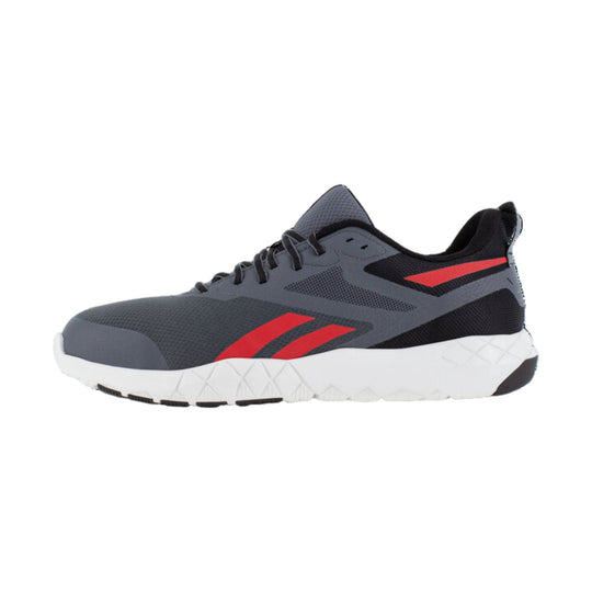 Gray and black athletic work shoe with red side accents and a white sole