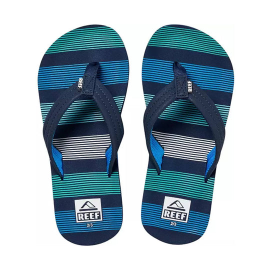 Pair of navy kids' flip flops with teal and blue striped footbeds, REEF logos, and 2/3 size marking