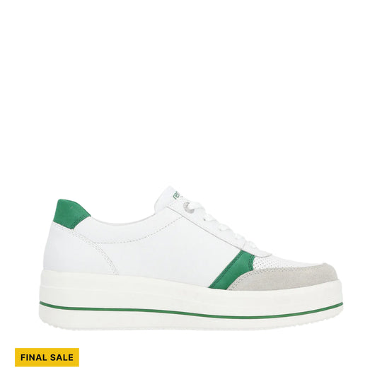 White platform sneaker with green heel and toe accents, shown in side view