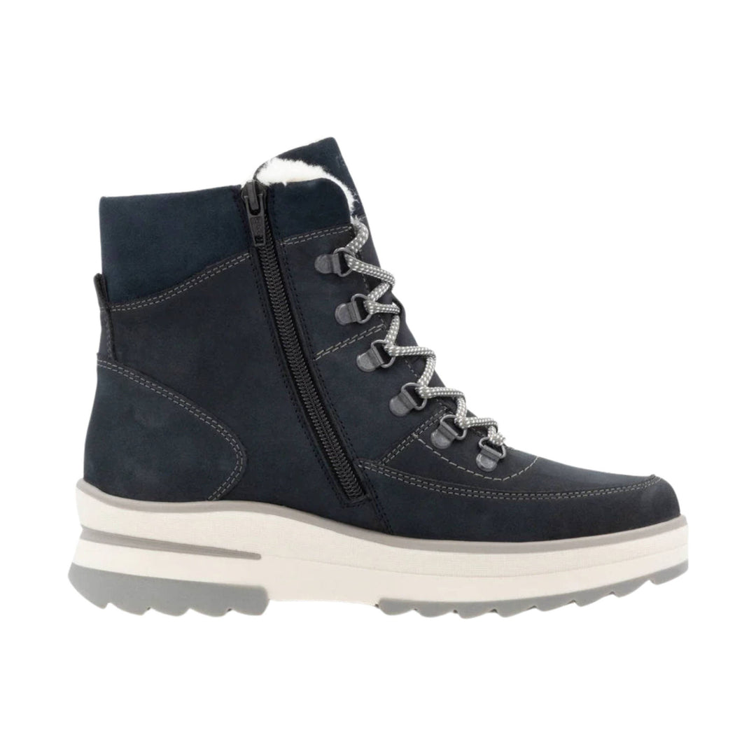 Navy lace-up winter boot with side zipper, faux fur collar, and thick white sole