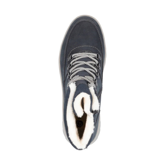 Navy lace-up winter boot with white faux-fur lining and speckled gray laces, viewed from above