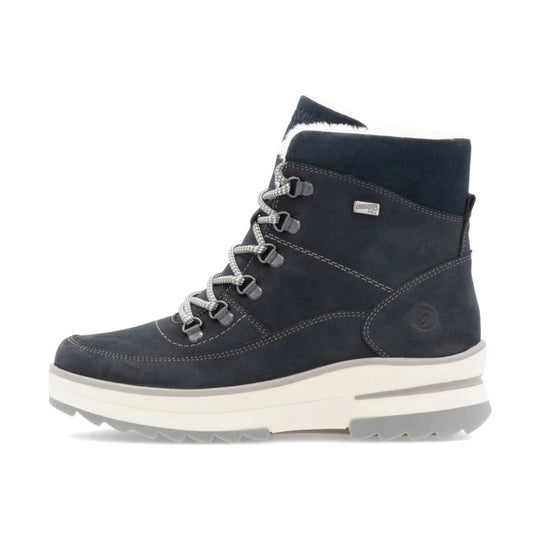 Dark navy lace-up winter boot with white platform sole and faux-fur lining