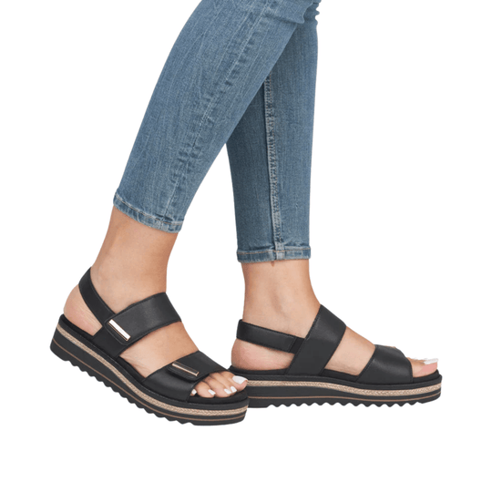 Black strappy platform sandal with open toe and woven sole trim