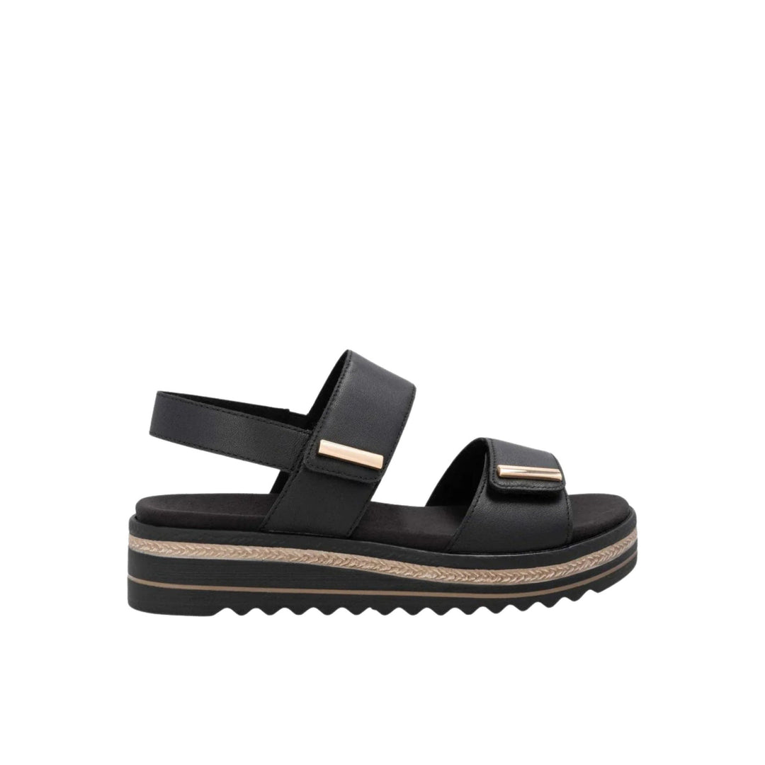 Black platform sandal with two wide straps and gold bar hardware