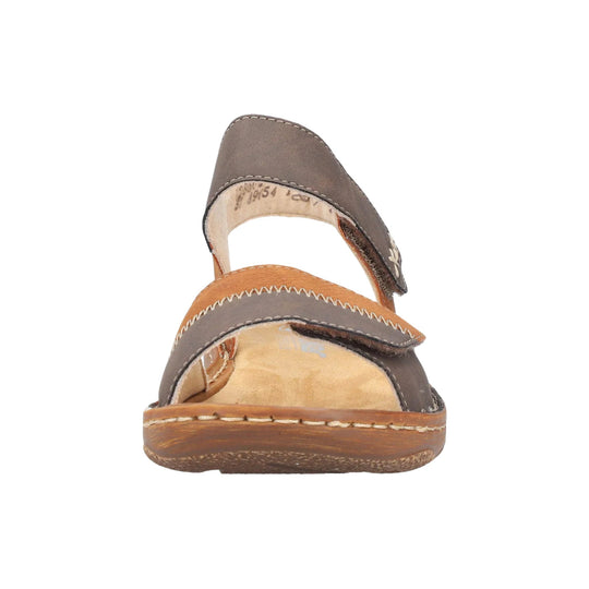 Two-tone closed-toe sandal with wide crossover straps and a tan sole, front view